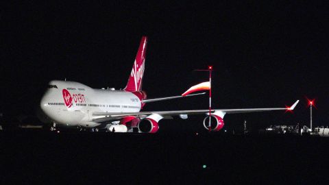 A repurposed Virgin Atlantic Boeing 747 aircraft carries Virgin Orbit's LauncherOne rocket.