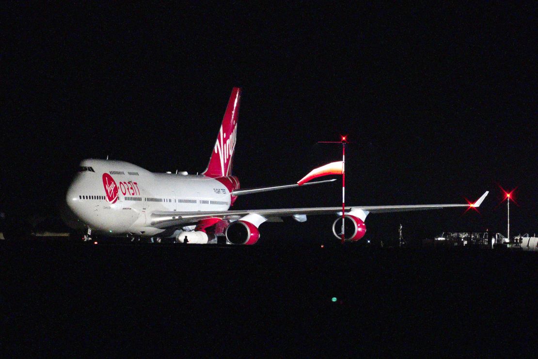 A repurposed Virgin Atlantic Boeing 747 aircraft carries Virgin Orbit's LauncherOne rocket.