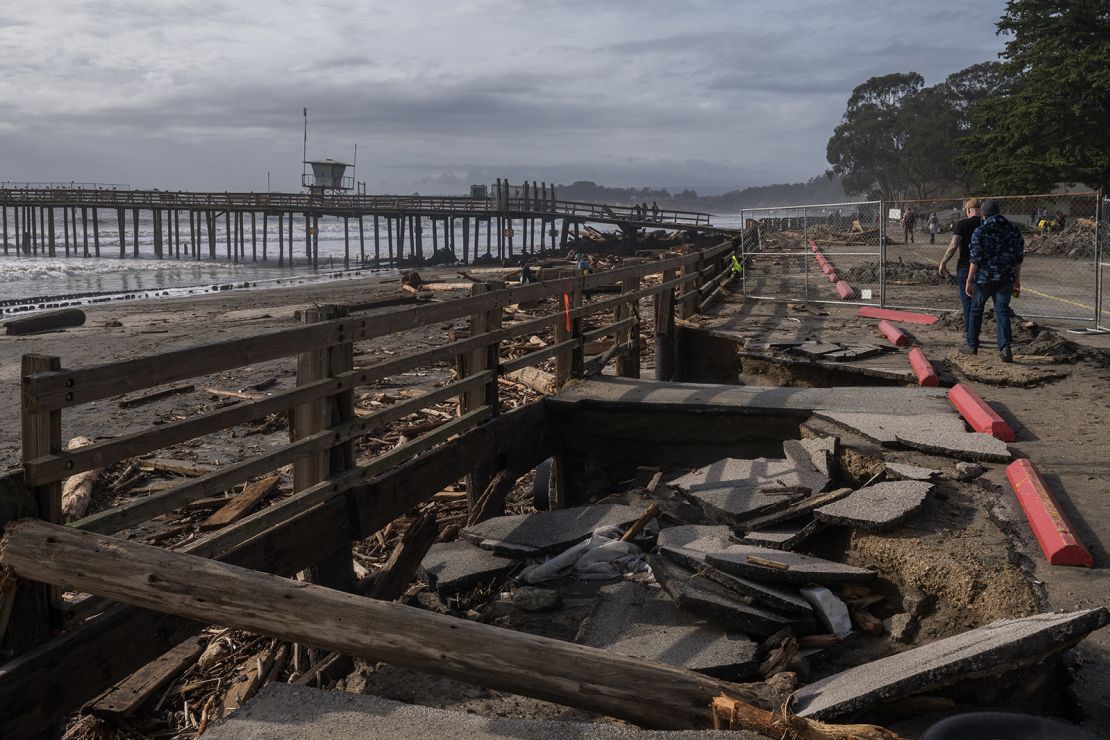 A section of a parking lot sits sunken Sunday after a storm at Seacliff State Beach in Aptos, California.