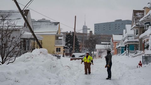National Grid workers respond to a downed utility pole in Buffalo, New York, on December 27. The damage from the multi-state blizzard is still being calculated. 