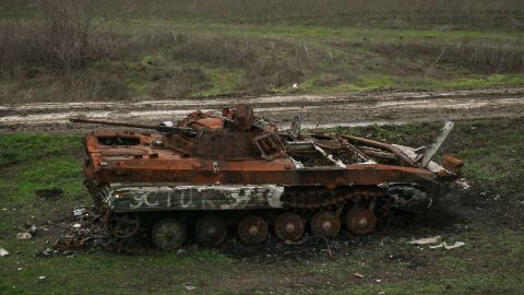 Destroyed Russian armored car standing by the railway line seen from the window of an evacuation train from Kherson to Khmelnytskyi, on Sunday, December 18, 2022.