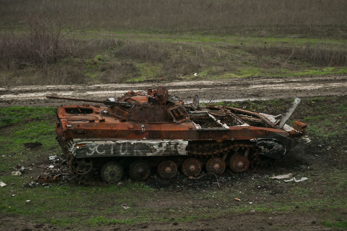 Destroyed Russian armored car standing by the railway line seen from the window of an evacuation train from Kherson to Khmelnytskyi, on Sunday, December 18, 2022.