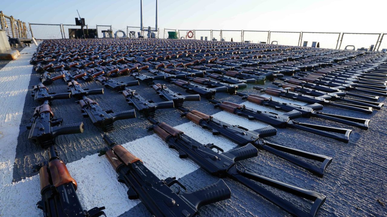 Thousands of AK-47 assault rifles sit on the flight deck of guided-missile destroyer USS The Sullivans during an inventory process, January 7. 