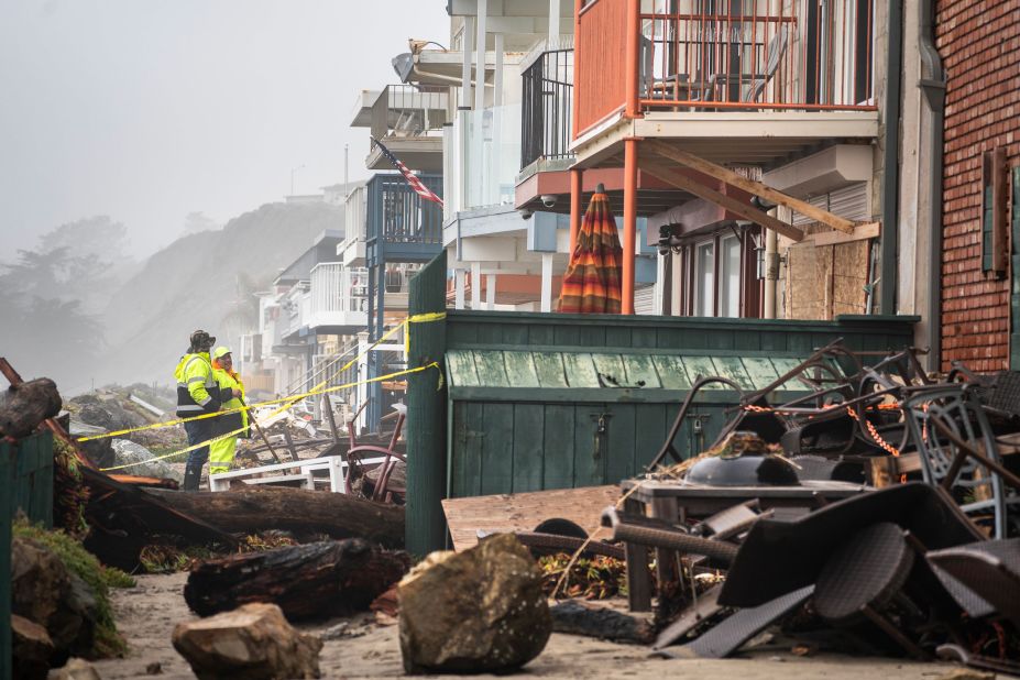 Cleanup takes place in Aptos on January 9 after streets and homes were flooded near the Rio Del Mar State Beach.