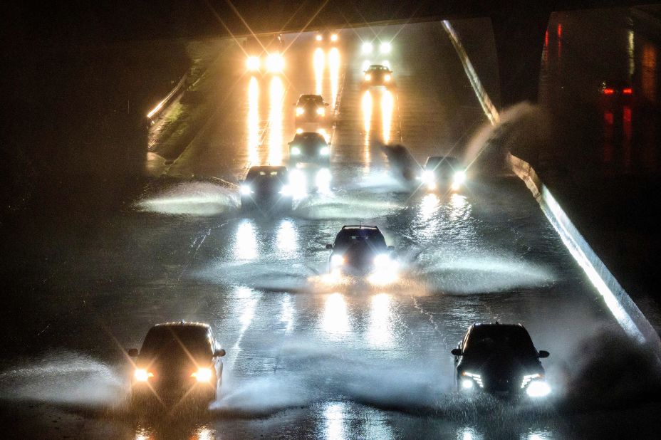 Drivers in San Francisco barrel into standing water on Interstate 101 on January 4.