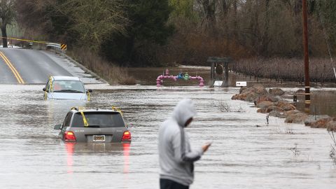 Cars were inundated with floodwaters after torrential rain lashed across Windsor, California, on Monday.
