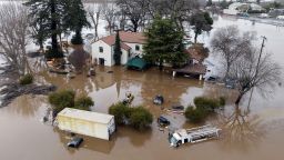 This aerial view shows a flooded home partially underwater in Gilroy, California, on January 9, 2023. 