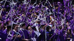 Confetti drops on graduates as they celebrate during a graduation ceremony for New York University at Yankee Stadium in New York, on May 18, 2022. 