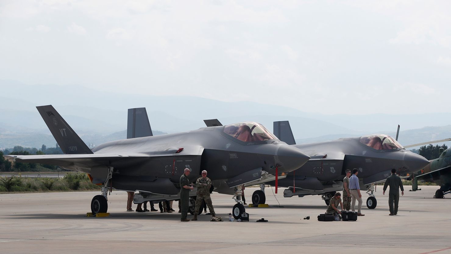 US military personnel work near an F-35 fighter jet of the Vermont Air National Guard, in the military base at Skopje Airport, North Macedonia, on June 17, 2022. 