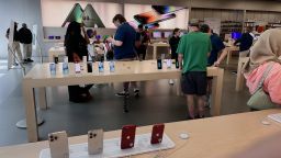 Customers shop at The Apple Store at the Towson Town Center mall, the first of the company's retail locations in the U.S. where workers voted over the weekend to unionize, on June 20, 2022 in Towson, Maryland. Following a late-pandemic era wave of workers demanding higher pay,  better benefits and more negotiating leverage, 65 of the 98 workers at the Towson Apple Store voted to join the International Association of Machinists and Aerospace Workers union on June 18. 