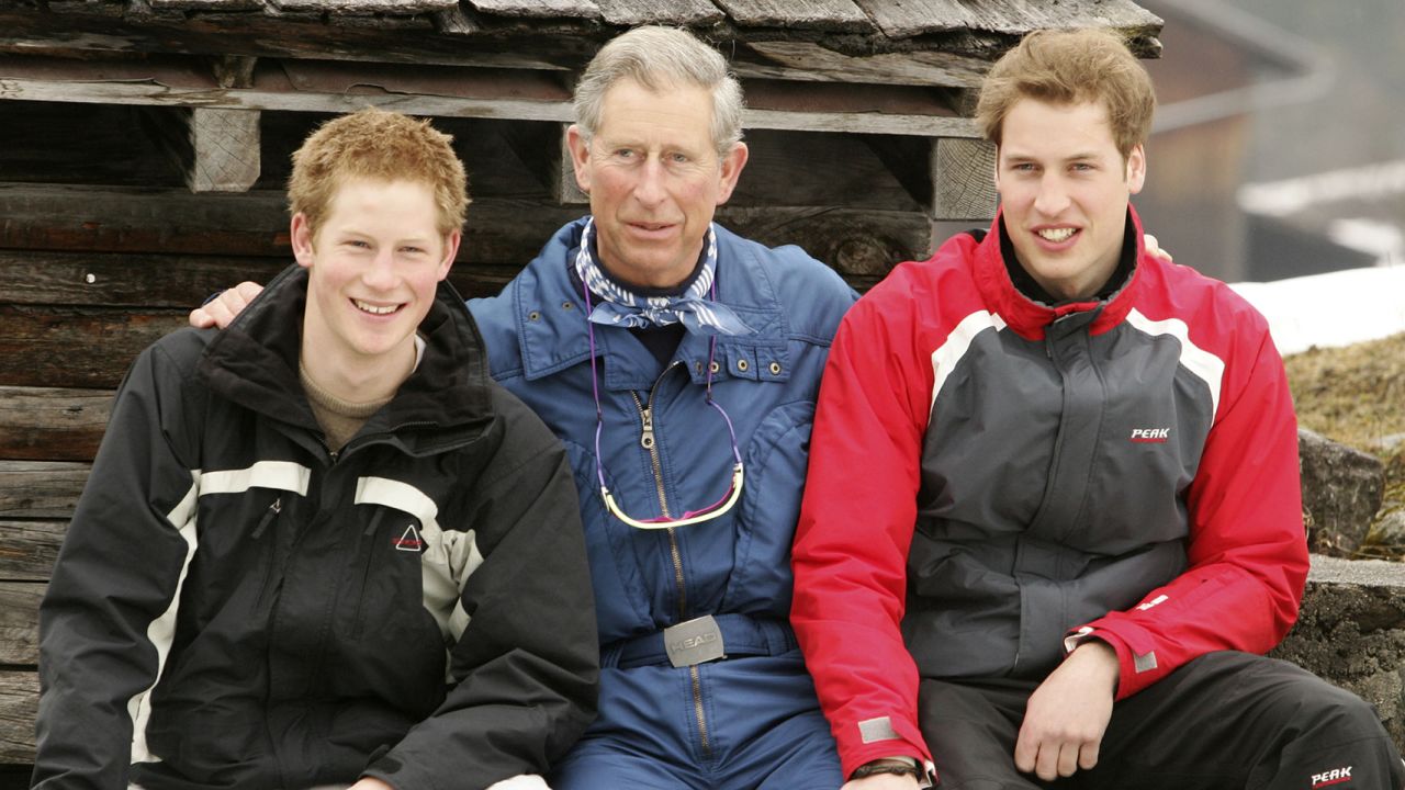 Then-Prince Charles poses with his sons Harry and William during a family ski holiday in Switzerland, 2005.  