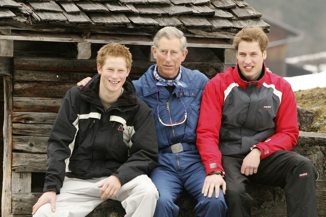 File photograph from 2005 of then-Prince Charles posing with his sons, Princes William and Harry during a ski break in Switzerland.