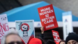Nurses and healthcare workers hold signs during a strike at Mount Sinai Hospital in New York, US, on Monday, Jan 9, 2023. More than 7,000 nurses at two major New York City hospitals went on strike Monday, saying staffing levels at private-sector facilities are inadequate and that pay should be higher. 