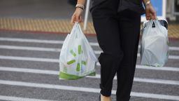 A shopper carries bags outside of a Walmart Inc. store in Torrance, California, U.S., on Tuesday, May 19, 2020. 