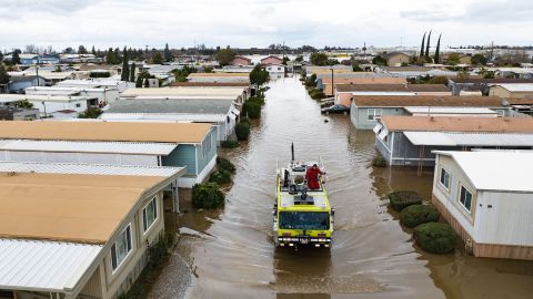 This aerial photo shows rescue crews assisting stranded residents in a flooded neighborhood in Merced, Calif., on Tuesday.