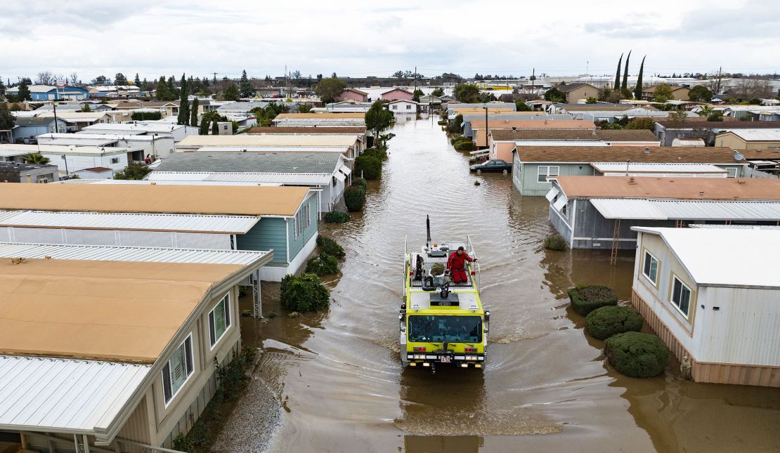 Rescue crews help stranded residents Tuesday in Merced, California.