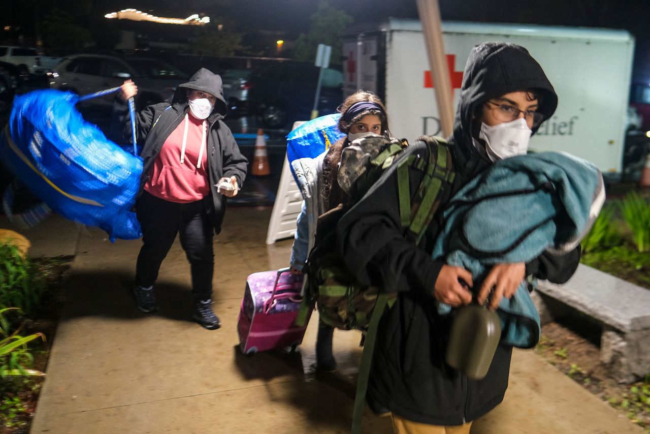 People arrive at an evacuation center in Santa Barbara on January 9.