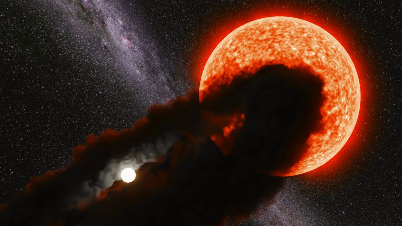 This artist's illustration shows the large, puffy star Gaia17bpp being partially eclipsed by a dust cloud that surrounds its mysterious smaller companion star.