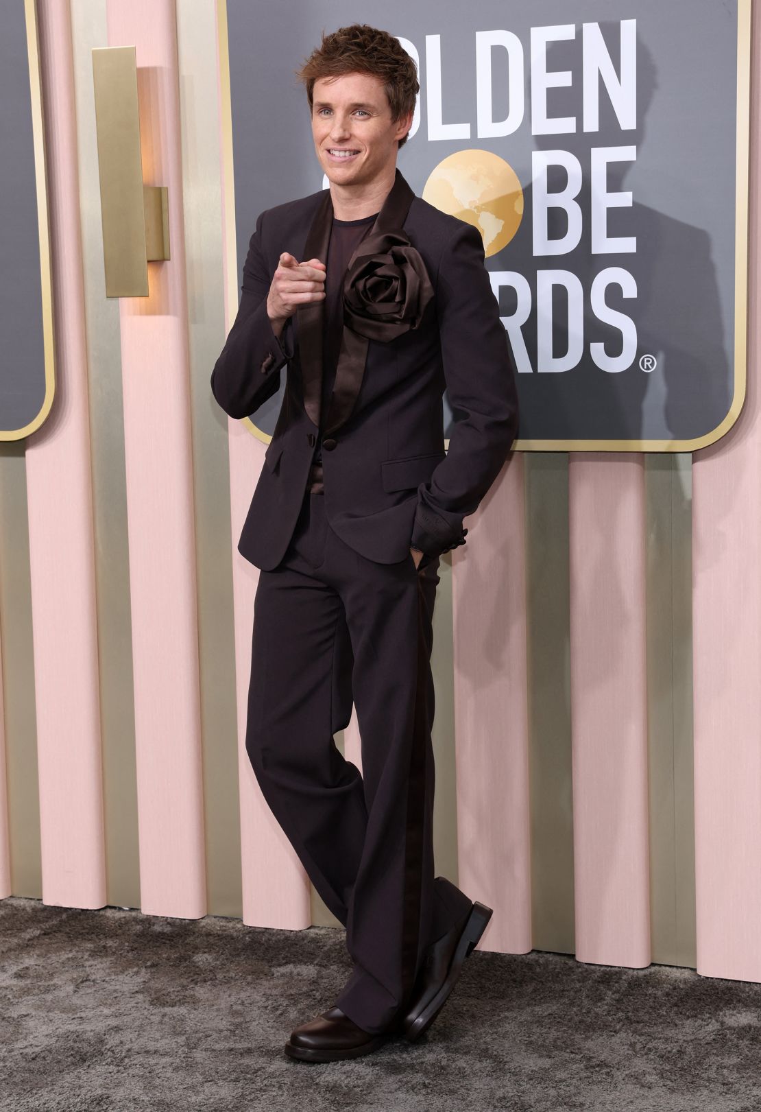 Eddie Redmayne's Valentino suit featured a large floral embellishment. 
