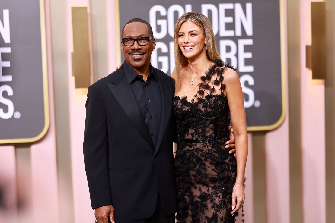 Eddie Murphy and his partner Paige Butcher, one of several attendees to wear black lace. 