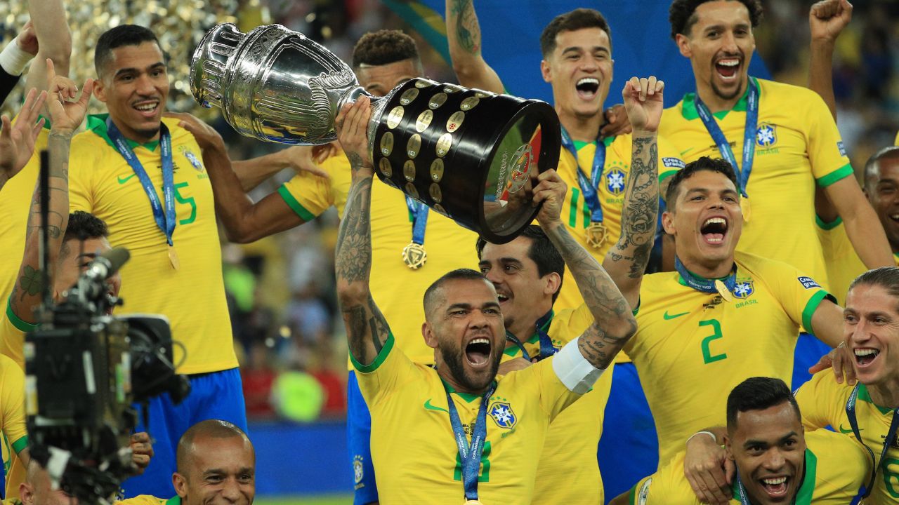 Dani Alves jcelebrates with teammates after winning the Copa America in 2019 after beating Peru in the final.