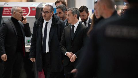 French Interior Minister Gerald Darmanin (third left) and Paris police prefect Laurent Nunez (second left) arrive at the Gare du Nord after several people were injured in an attack at the train station. 