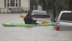 A man kayaks through a neighborhood in Santa Barbara, California on January 9.