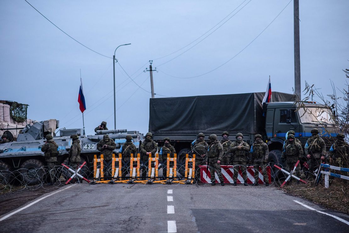 Russian peacekeepers block the road outside Stepanakert, the main city in the breakaway Nagorno-Karabakh region, on December 24, 2022. 