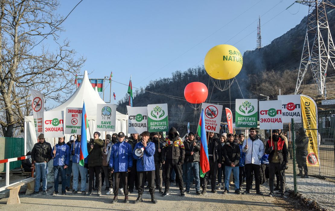 Azerbaijani demonstrators stage a protest, over what they claim is illegal mining, in the Lachin corridor, the breakaway Nagorno-Karabakh region's only land link with Armenia, on December 26, 2022. 