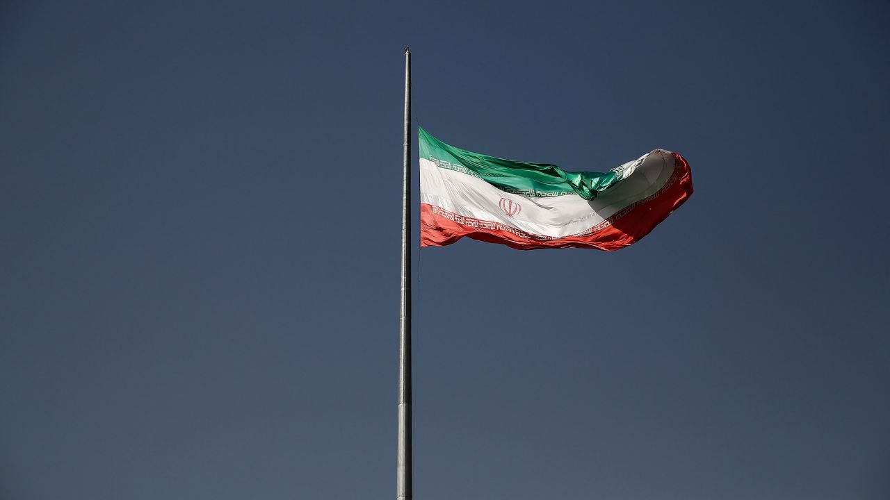 An Iranian national flag flies from a flagpole in a residential district of Tehran, Iran. The British government has called for Iran halt the execution and release Alireza Akbari.