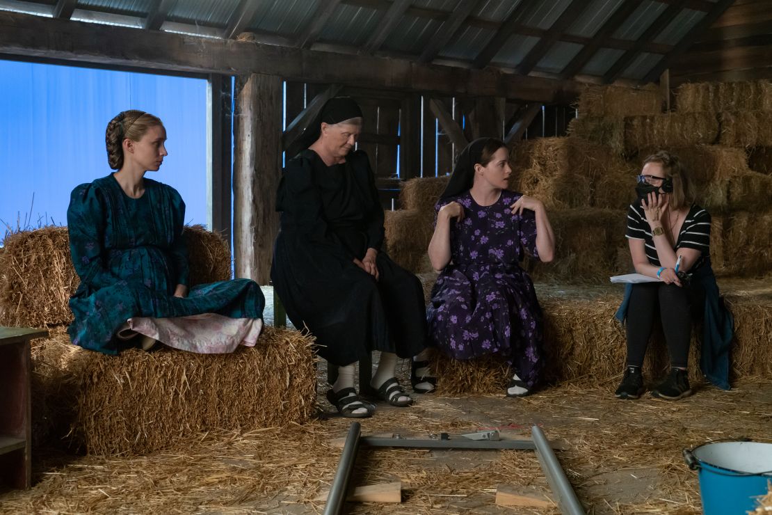 Actors Rooney Mara, Judith Ivey, Claire Foy and director Sarah Polley on set of the film "Women Talking"