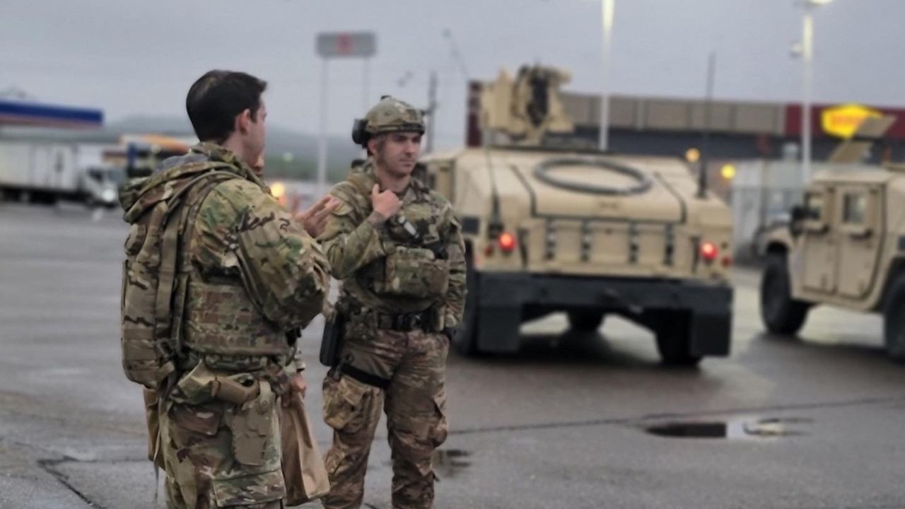Soldiers with the 270th Military Police Company are seen en route to aid the search for Kyle. 