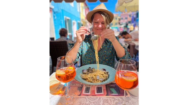 <strong>Foodie fans:</strong> Tucking into a bowl of spaghetti during a visit to Italy.
