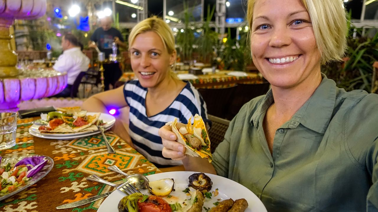 <strong>Global tour: </strong>Davey and Sebova enjoy a meal together while visiting<strong> </strong>Aleppo, Syria.