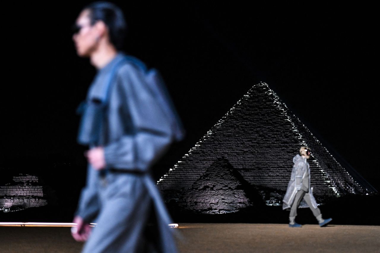 Models walk in a menswear show at the Giza Pyramids in Egypt, staged by Dior in December 2022.  