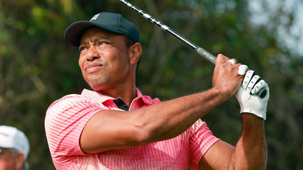 Tiger Woods hits his opening drive of the PNC Championship golf tournament  in December.