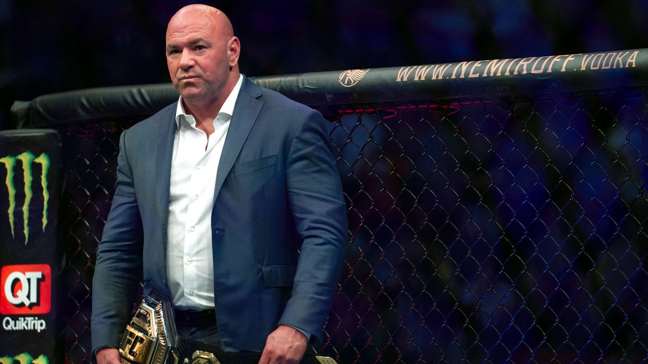 White waits to place the UFC lightweight championship belt on Charles Oliveira after the Brazilian's victory against Michael Chandler in 2021. 