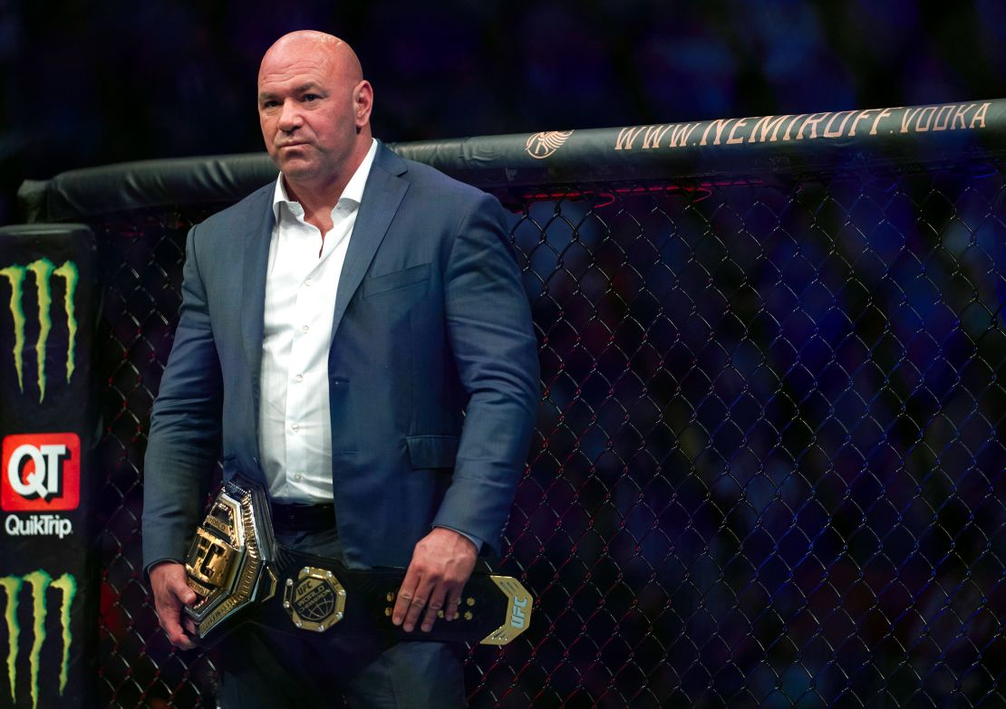 White waits to place the UFC lightweight championship belt on Charles Oliveira after the Brazilian's victory against Michael Chandler in 2021. 