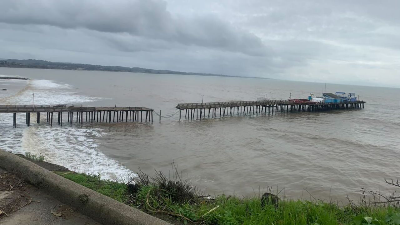 The Wharf House, shown here on January 8, sits at the end of a wooden pier that was cut off from land by heavy rain and waves. 