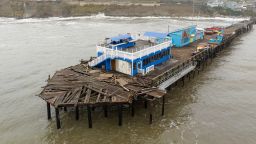 This aerial view shows a damaged pier is split in Capitola, California, on January 9, 2023. 
