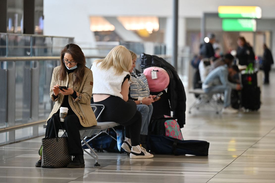 Passengers wait for their flights at LaGuardia airport in New York on January 11, 2023. 