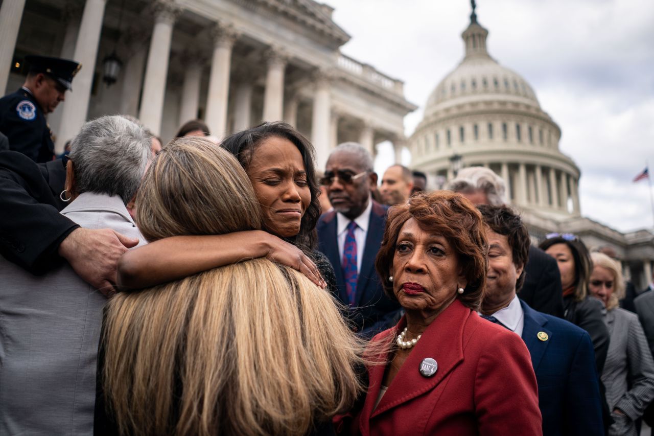 Serena Liebengood, widow of Capitol Police officer Howie Liebengood, is comforted by members of Congress on Friday, January 6, after a ceremony marking the second anniversary of the <a href=