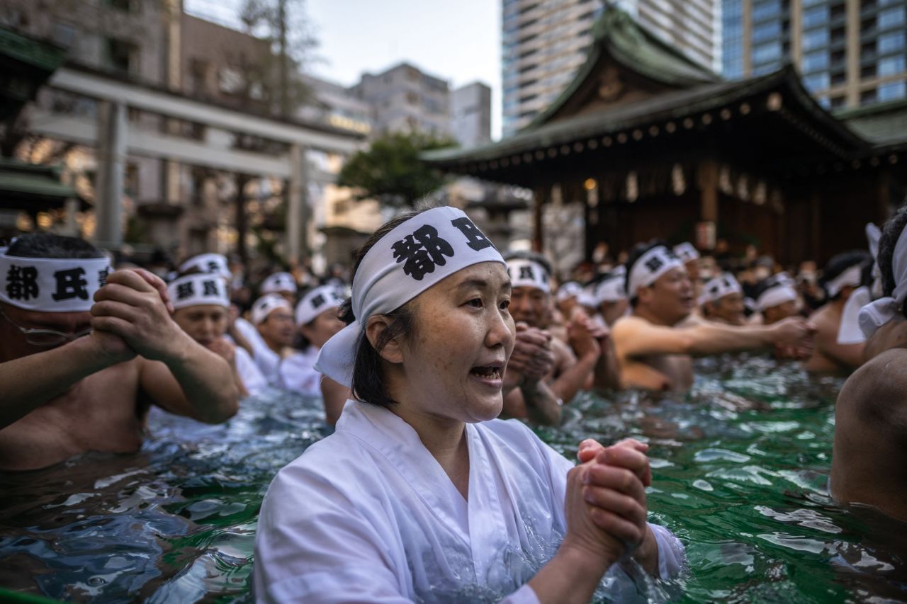 People at the Teppozu Inari Shrine take a bath in cold water during a New Year ritual in Tokyo on Sunday, January 8.