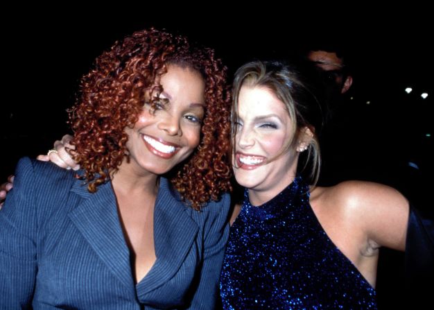 Presley joins Janet Jackson at a New York party to celebrate the release of Jackson's 1997 album, "The Velvet Rope."