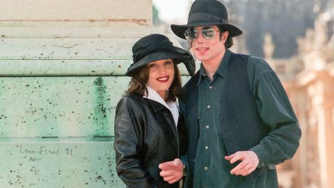 Lisa Marie Presley and Michael Jackson pose for a photo 