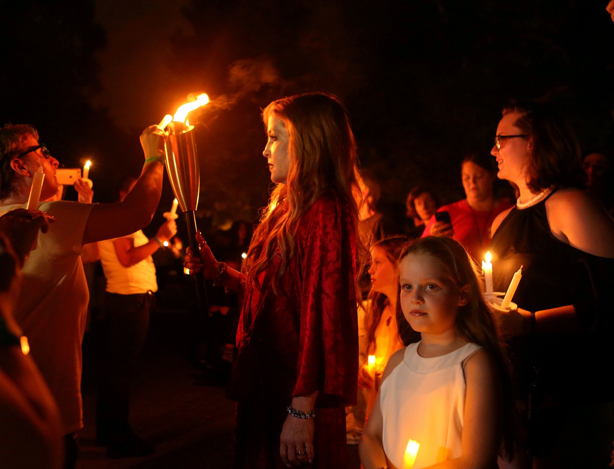 Presley lights candles on the 40th anniversary of Elvis' death at Graceland in 2017.