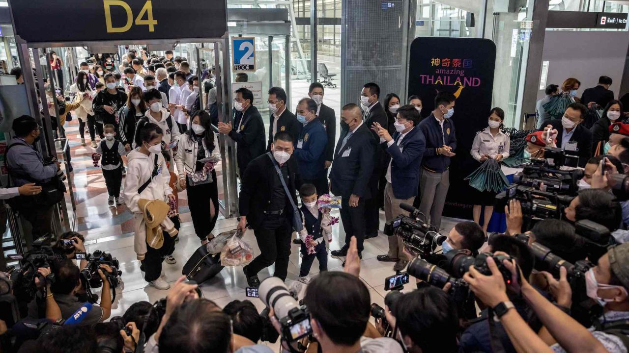 Travelers from a Xiamen Airlines flight being welcomed by Thai officials upon arrival at Suvarnabhumi Airport in Bangkok on Jan. 9, 2023.