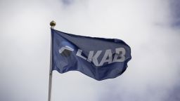 A flag displays the logo of LKAB, Sweden's state-owned mining company, as it flies outside a mine in Svappavaara, Sweden, on Thursday, Aug. 22, 2013.