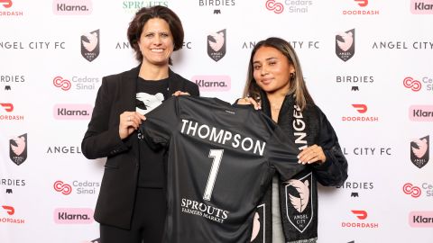 Alyssa Thompson poses with Angel City FC president Julie Uhrman having been selected with the first overall draft pick.