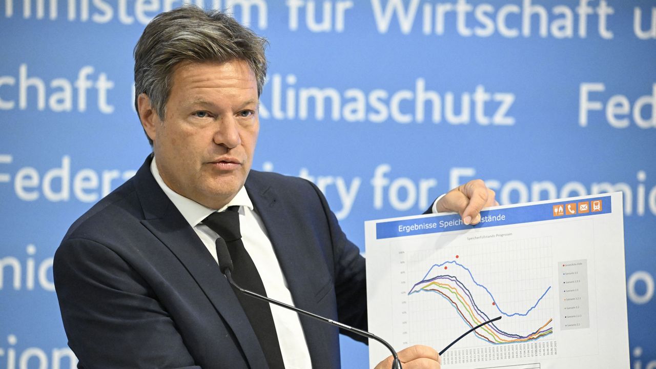German Minister of Economics and Climate Protection Robert Habeck shows a graph featuring forecasts of gas storage levels as he gives a press conference on energy supply security, on June 23, 2022 at his Ministry in Berlin.